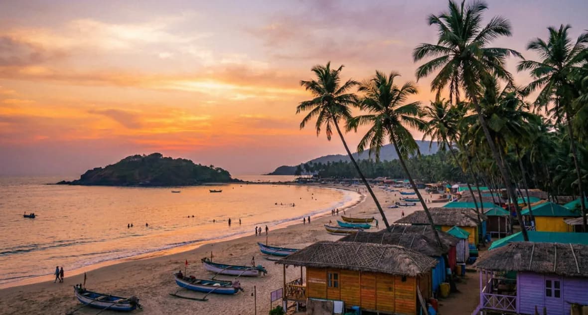 Palm-fringed Goa beach at sunset