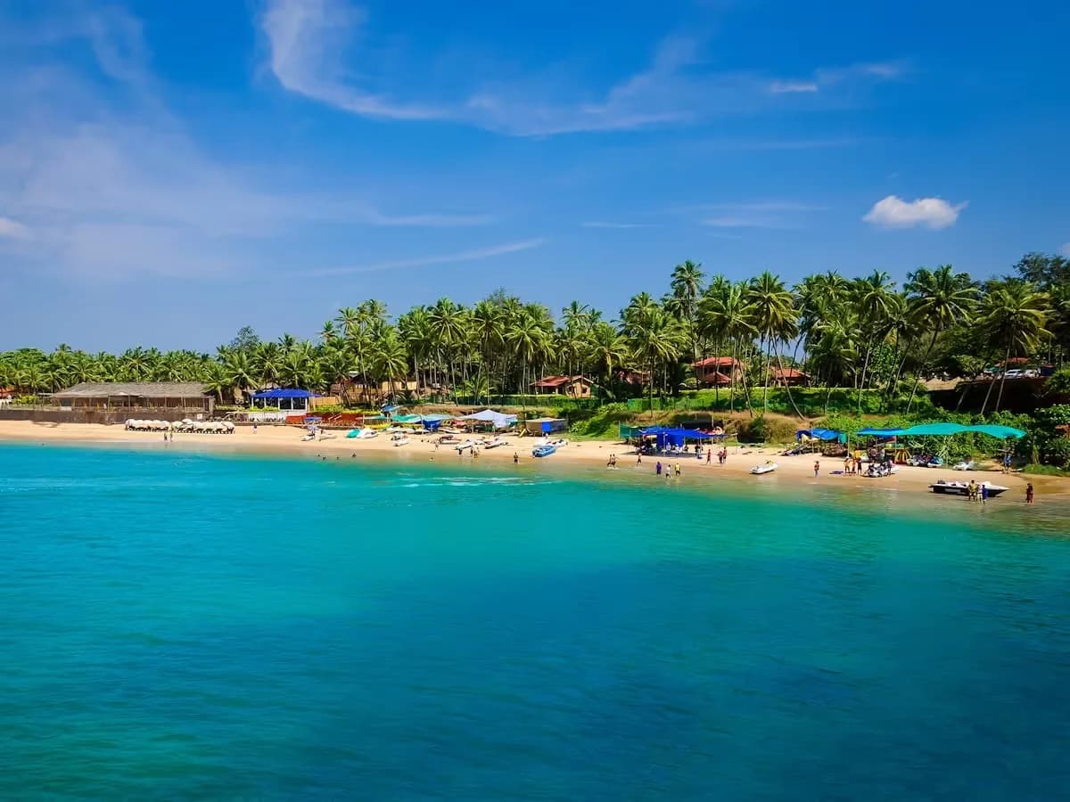 Turquoise sea and a palm-lined beach in Goa
